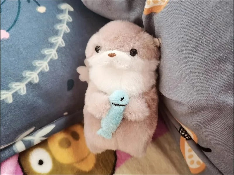 Otter Holding Fish Keychain