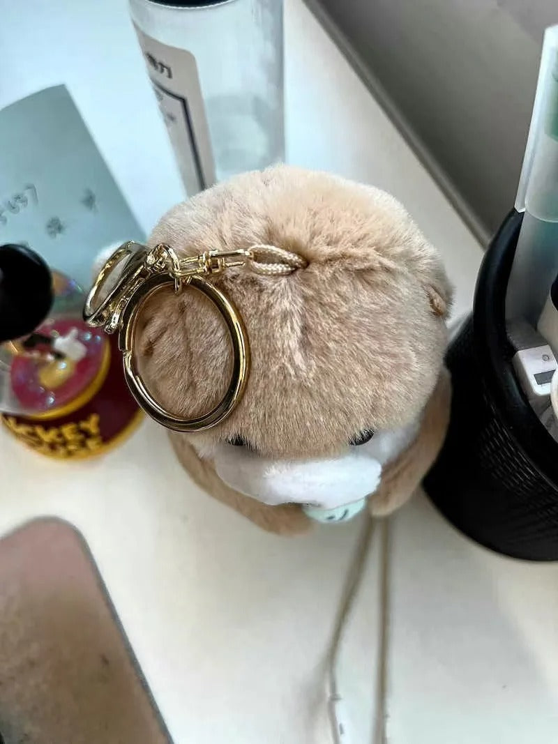 Otter Holding Fish Keychain