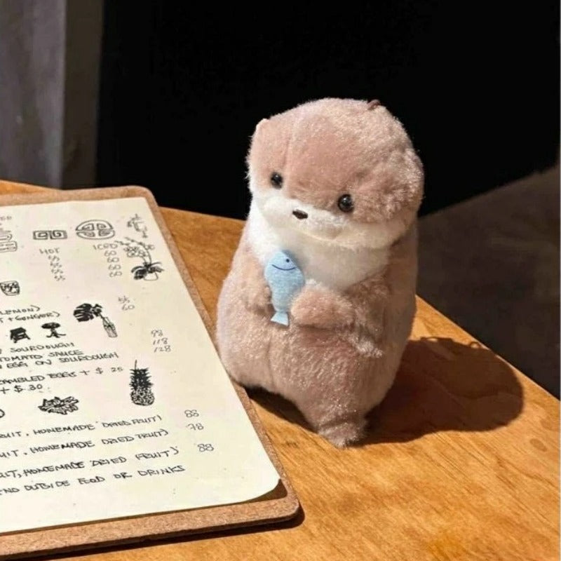 Otter Holding Fish Keychain